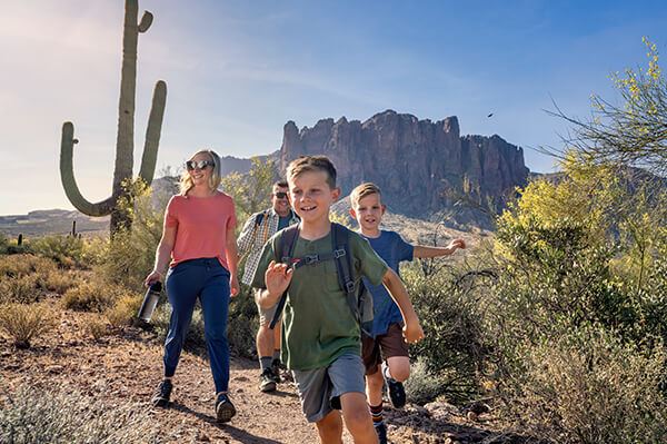 Family hiking at Superstition Mountains near Blossom Rock Mesa, Arizona